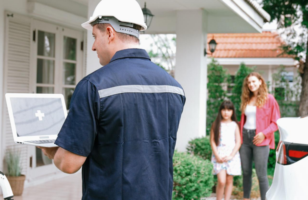 Licensed electrician consulting with homeowner for EV charger installation at residential property Toronto, Phaze-In Electric Ltd.